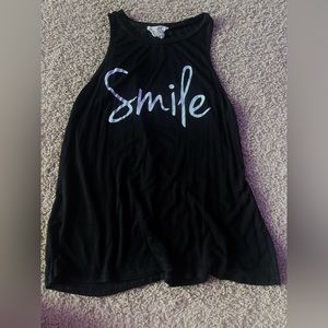 Loose fit. Nice, soft material. Barely worn.